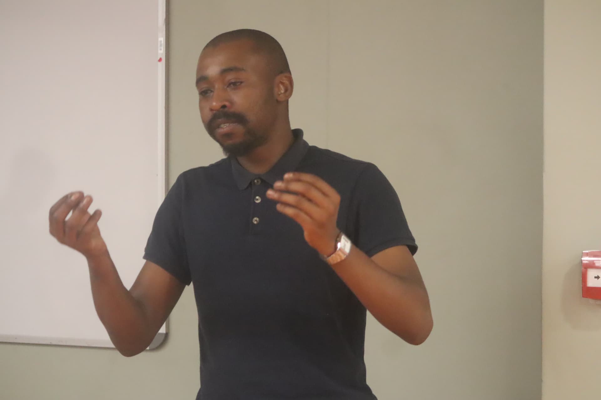 A facilitator explaining a concept during a Northern Cape hackathon session