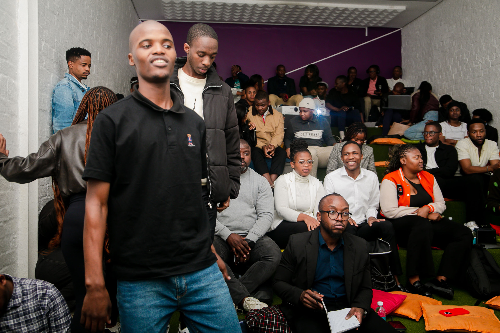 Participants seated together listening during a Cortex Accelerator Hub session