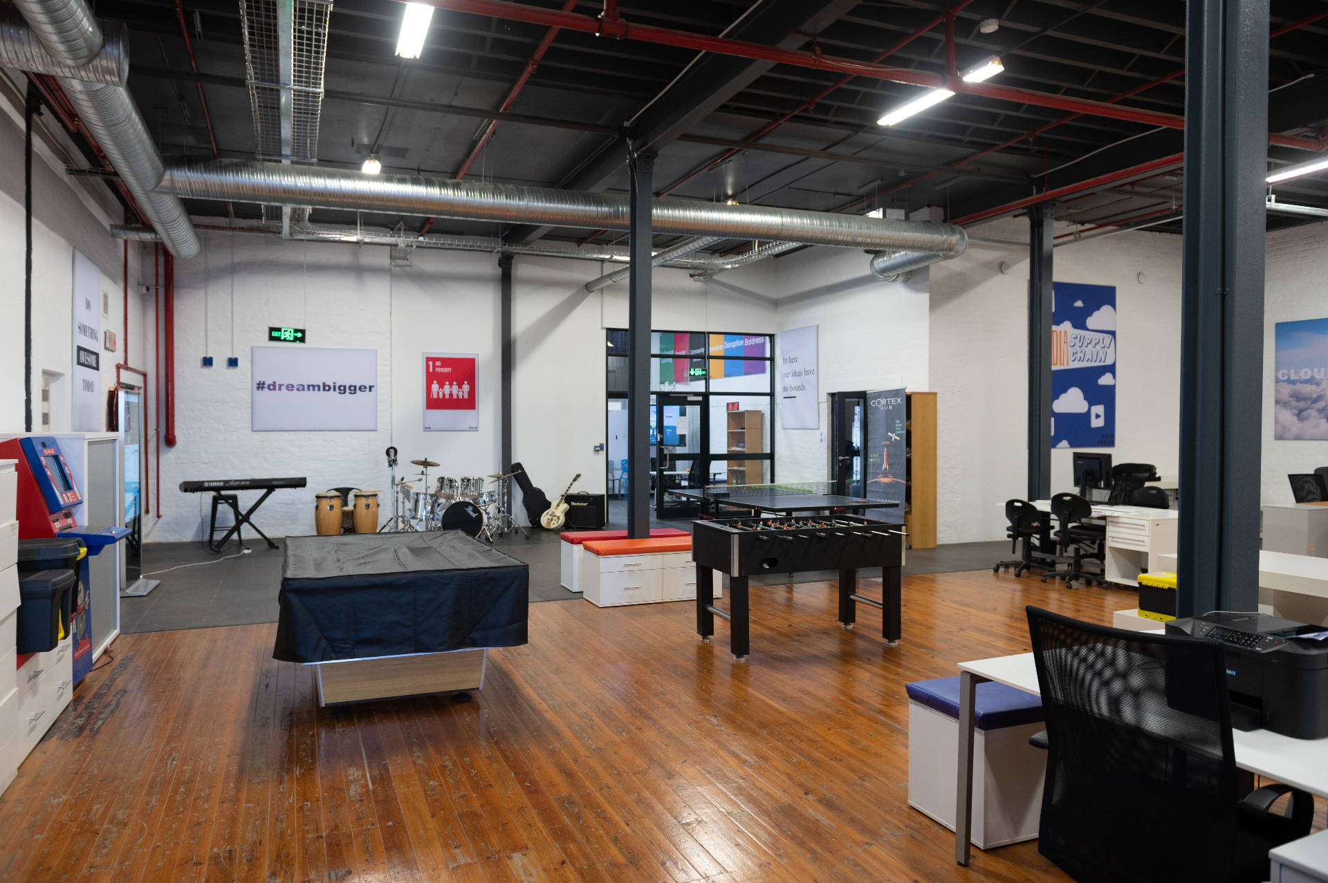 Creative area with instruments, table tennis and posters at the Cortex Accelerator Hub